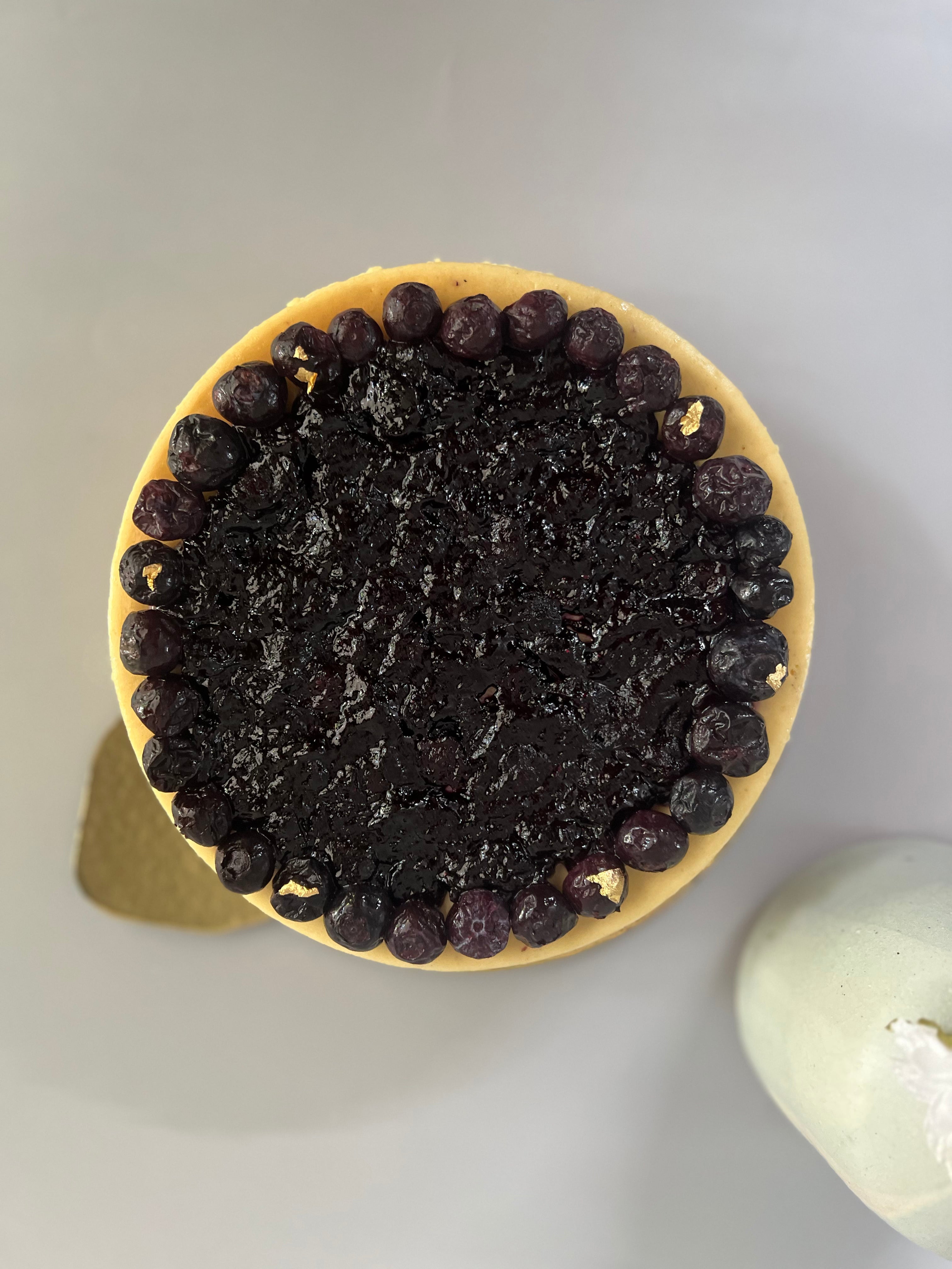 Cheesecake with bluberry filling  on white background
